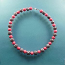 S353 A shiny polymer clay necklace with tapering grey and white swirl beads interspersed with smaller pretty pink beads. The necklace measures 47 cm (18½ inches) long, and has a sterling silver clasp.